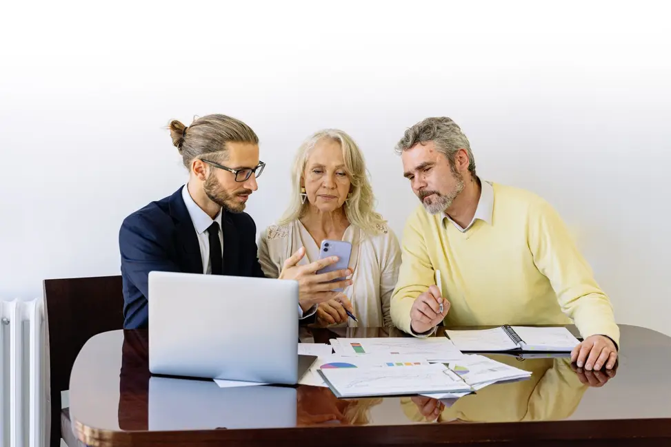 Person showing two other people info about installment loans on his phone.