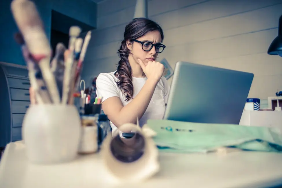 Person on their laptop researching lines of credit online.