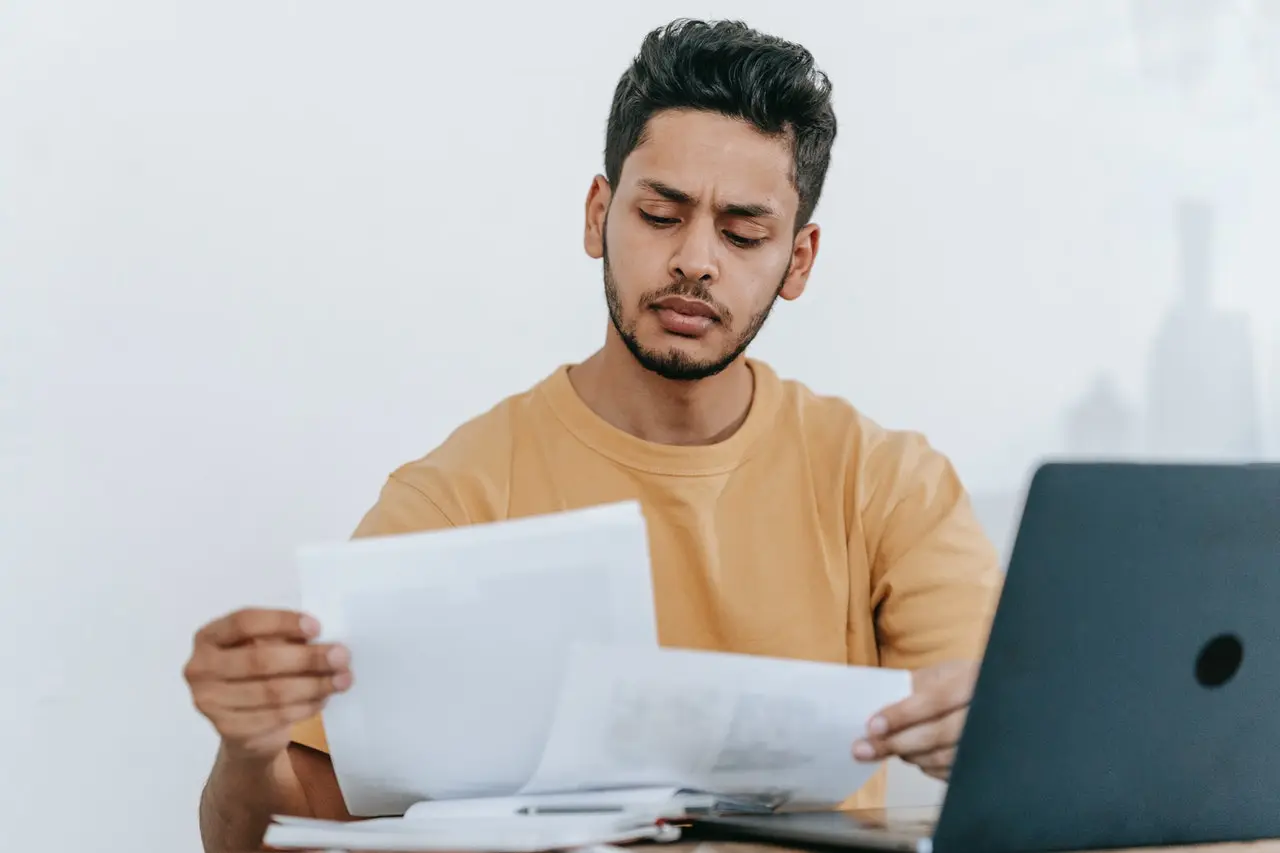 Person looking at personal loan contracts.