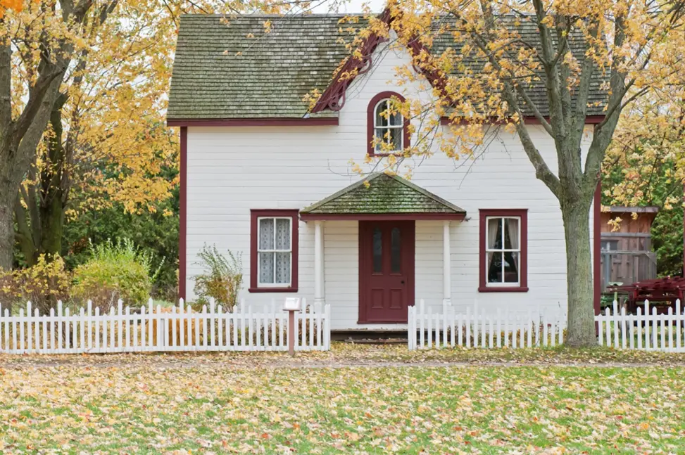 White house with white picket fence.