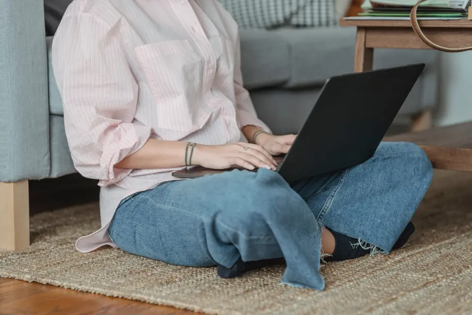 Person researching cosigner loans on their laptop.