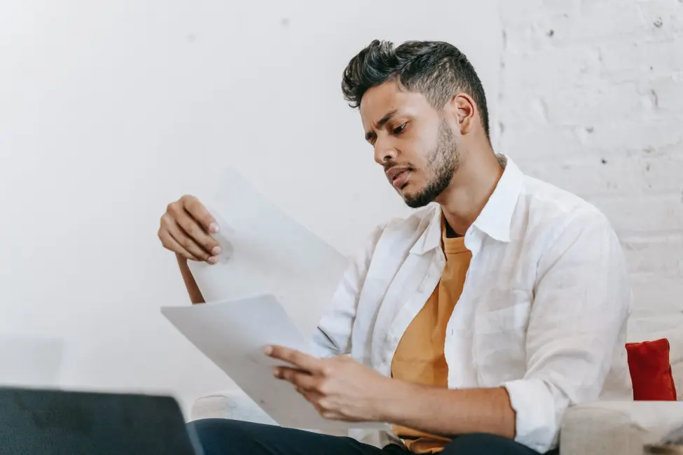 Person reviewing personal loan contract.