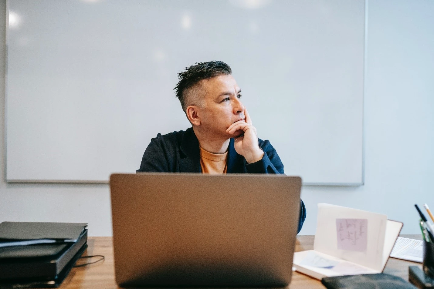 Person sitting in front of computer looking sideways.